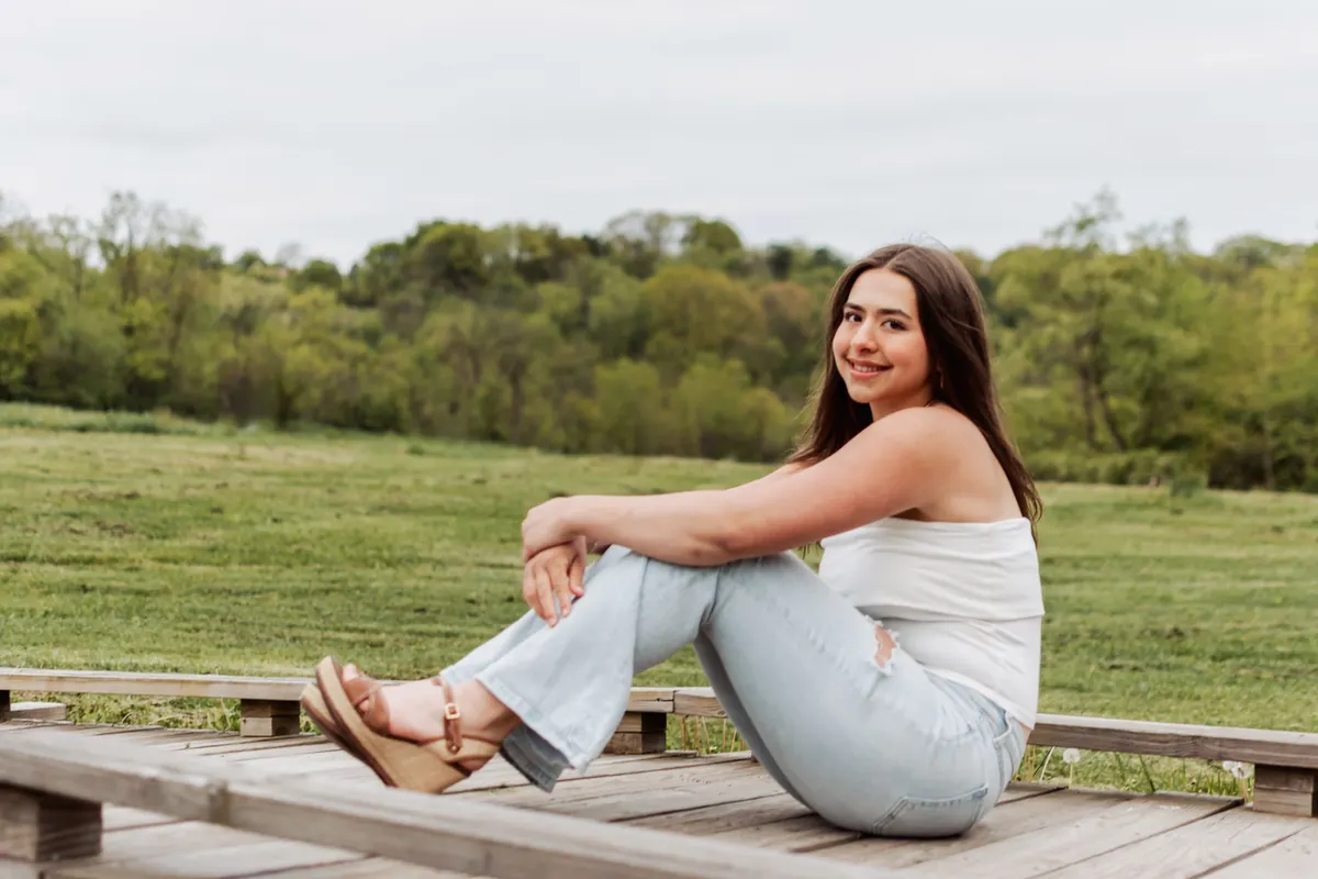 Senior sitting on the boardwalk at Boyce Mayview Park in Upper St. Clair