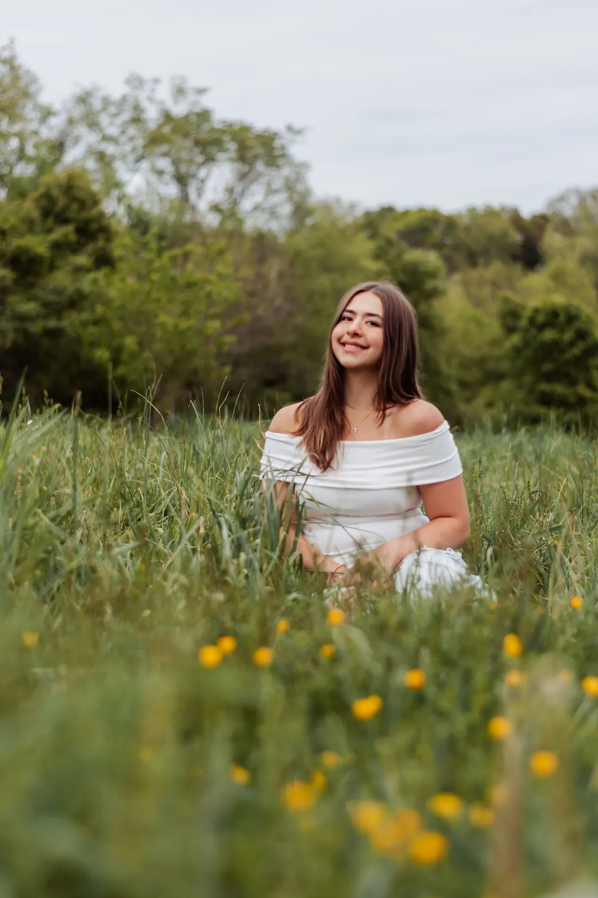Senior sitting in a wildflower field in Upper St. Clair