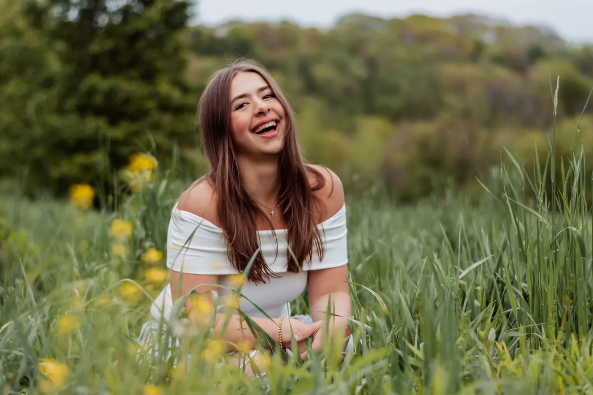 Senior laughing among wildflowers at Boyce Mayview Park